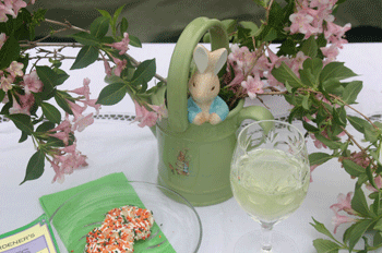 A watering can with flowers.