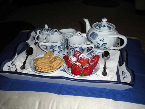 Tea and cookies and strawberries.