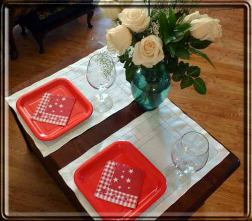Red plates with red and white napkins.