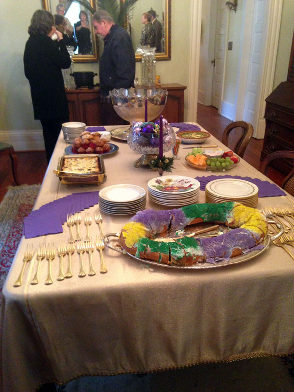 The King Cake sets the mood for the celebration.